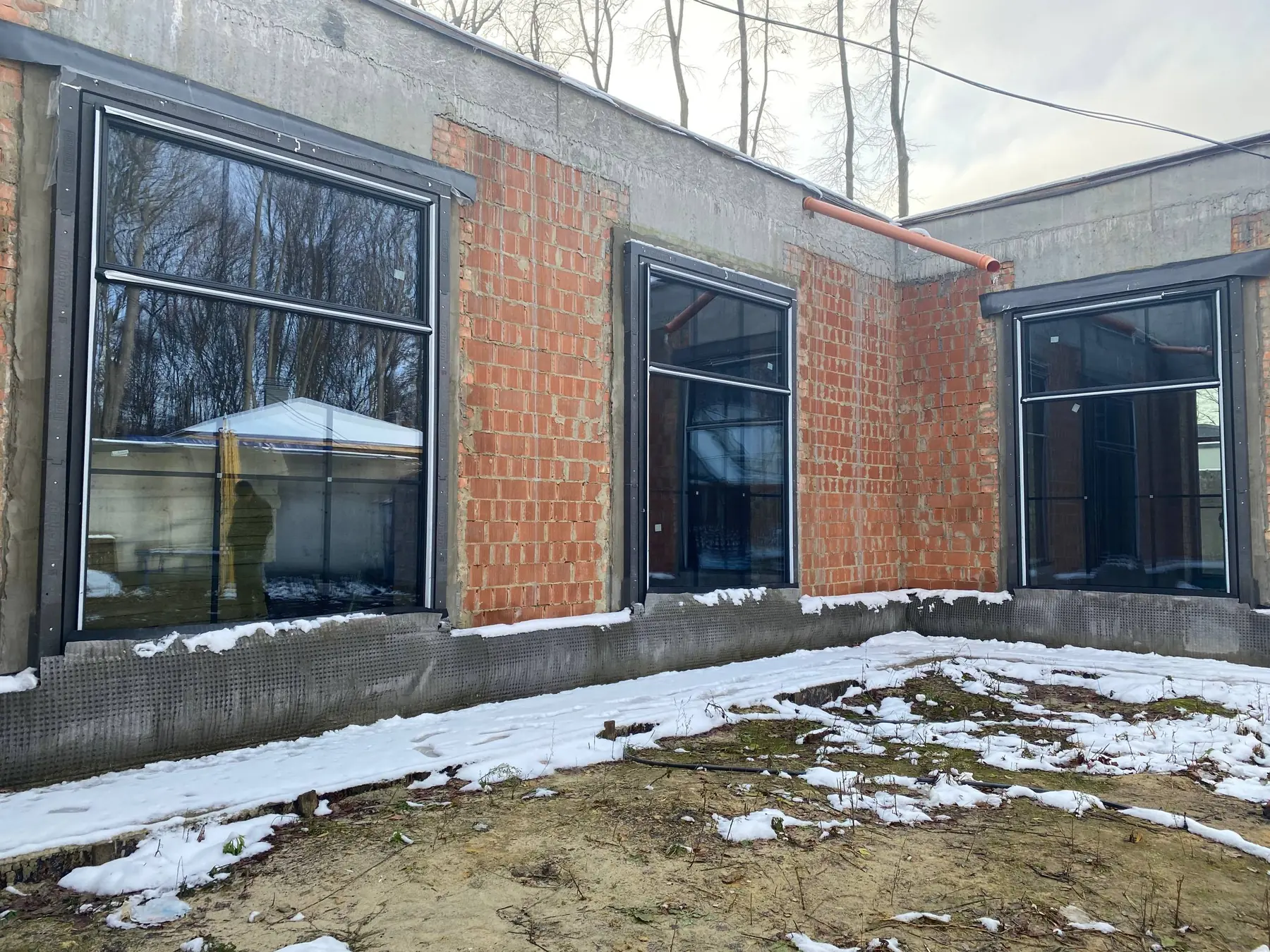 Kharkiv house — courtyard elevation with dark frames
